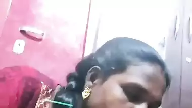 Mature tattooed Tamil wife giving handjob to husband