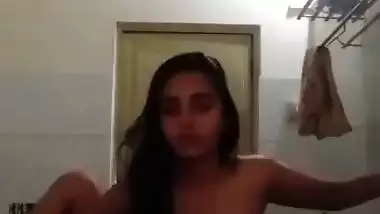 Indian nude MMS of an 18-year-old girl fingering in a bathroom