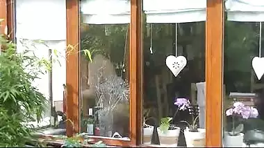 NRI house wife cleaning glass and showing naked figure